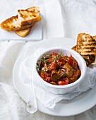Spicy chicken liver with peri-peri sauce, tomatoes and ciabatta toast