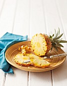 A fresh pineapple on a plate