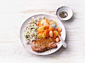 Gammon with colourful carrots and onion barley