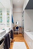 Twin washstand and dressing table in bathroom