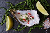 Marinated oyster with lemons and seaweed