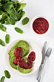 Sweet spinach pancakes with strawberry sauce