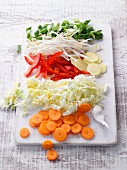 Chopped vegetables for stir-frying on a chopping board