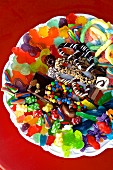 A colourful assortment of sweets on a white plate