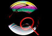 Soap bubble with light interference patterns