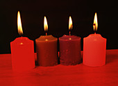 Candles under red light