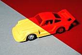 Yellow toy car under red light
