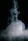 Liquid nitrogen being poured into flask