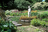 Statue in a formal garden pond