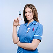 Nurse pumping a syringe