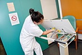Nurse cleaning hospital table