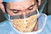 Surgeon spattered with blood