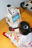 iRobi Q domestic toy robot and girl