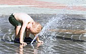 Boy in a fountain