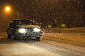 Car driving through heavy snow