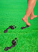 A woman's feet leaving carbon footprints