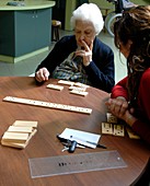 Alzheimer's patient plays dominoes