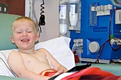 Boy undergoing kidney dialysis