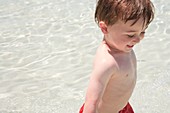 Small boy at the beach,fun in the sun