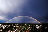 Double rainbow over a town