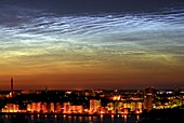 Noctilucent cloud over a city
