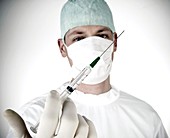 Anaesthetist with syringe
