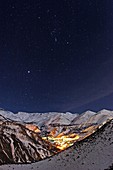 Night sky over a mountain village,Iran