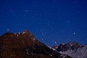 Orion rising over mountains