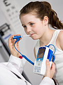 Pediatrician examining a girl