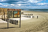 Polluted beach warning sign