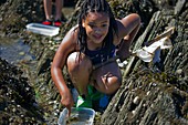 Young girl pond dipping