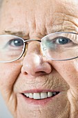 Elderly woman wearing glasses