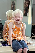 Girl with ectodermal dysplasia with wig