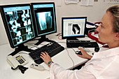 Radiologist assessing X-rays