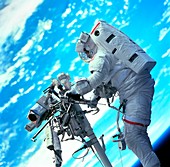 Shuttle astronaut on remote manipulator