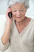 Elderly woman using a mobile phone