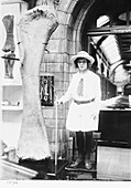 Girl and dinosaur bone,1920s