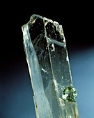 Spodumene crystal and cut stone