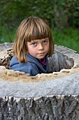 Girl playing in a tree