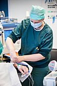 Anaesthetist preparing for surgery
