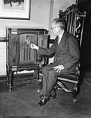 Diplomat listens to radio broadcast,1936
