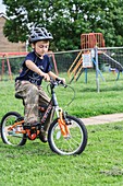 Boy learning to ride a bicycle