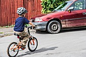 Boy learning to ride a bicycle