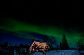 Aurora borealis over a tent