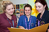 Nurses discussing patient notes