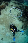 Diver blowing bubble rings