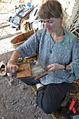 Woman Carding Sheep's Fleece