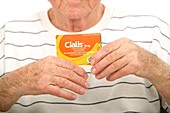 Elderly man with cialis tablets