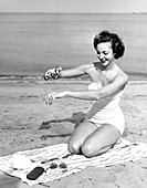Sun tan oil aerosol use,1950s