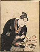 Kabuki actor writing on a fan